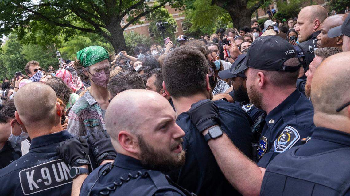Pro-Palestinian demonstrators clash with police after replacing an American flag with a Palestinian flag Tuesday, April 30, 2024 at UNC-Chapel Hill. Police removed a “Gaza solidarity encampment” earlierTuesday morning.