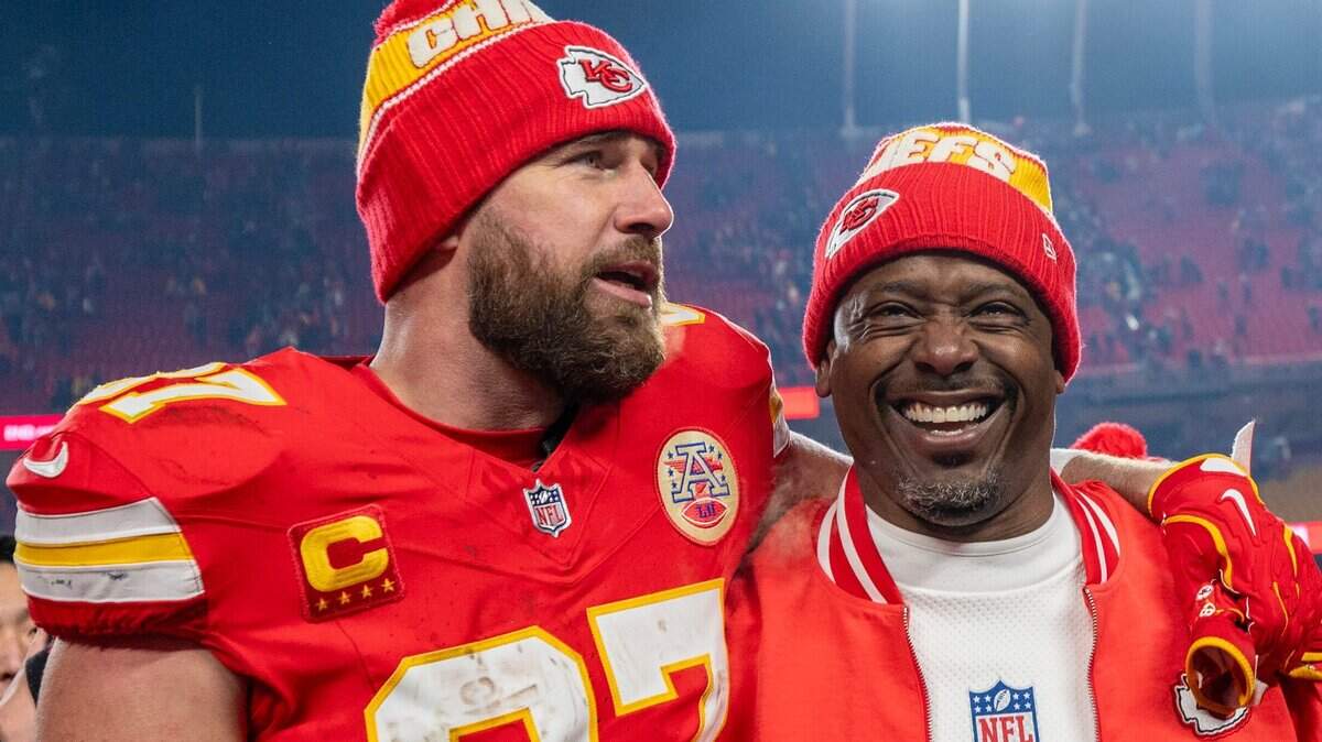 Kansas City Chiefs tight end Travis Kelce (87) walks off the field with Chiefs defensive backs coach Dave Merritt after the Chiefs’ 23-14 victory against the Houston Texans in the AFC Divisional Round playoff game on Saturday, Jan. 18, 2025, at GEHA Field at Arrowhead Stadium.