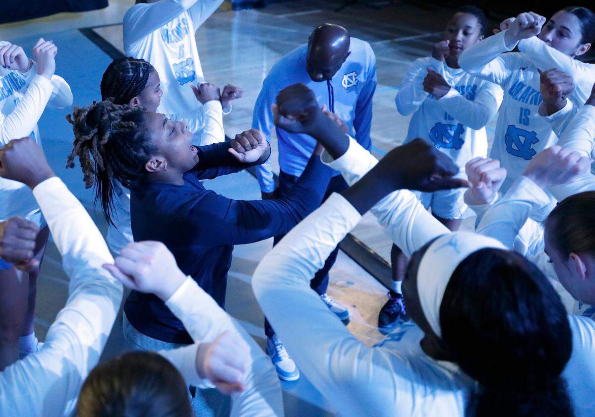North Carolina’s Kayla McPherson, center, rallies her teammates in the huddle prior to the Tar Heels’ game against Kentucky in the ACC/SEC Challenge on Thursday, Dec. 5, 2024, at Carmichael Arena in Chapel Hill, N.C.