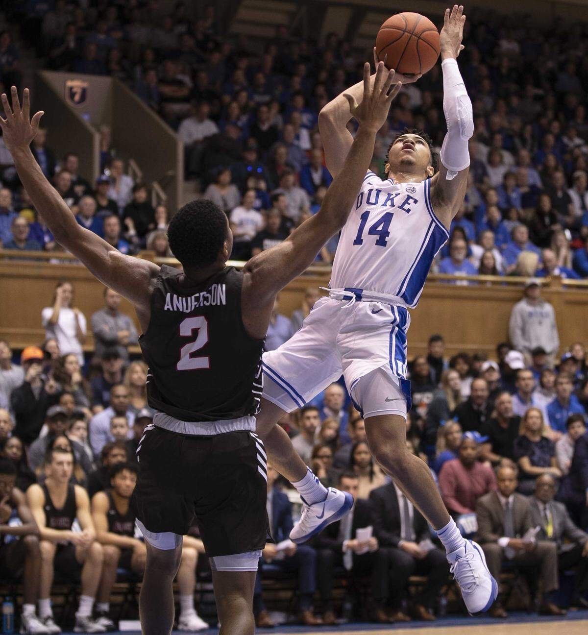 Duke’s Jordan Goldwire (14) puts up a shot against Brown’s Brandon Anderson (2) during the first half on Saturday, December 28, 2019 at Cameron Indoor Stadium in Durham, N.C.