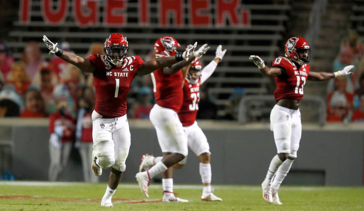 N.C. State linebacker Isaiah Moore (1) and the defense celebrate after Duke place kicker Charlie Ham (44) missed a field goal late in the second half of N.C. State’s 31-20 victory over Duke at Carter-Finley Stadium in Raleigh, N.C., Saturday, Oct. 17, 2020.
