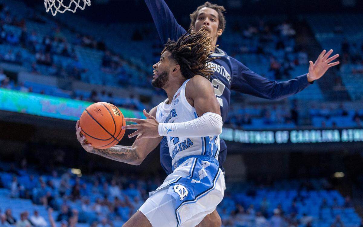 North Carolina’s R.J. Davis (4) drives to the basket against St. Augustine’s Jefferson Youngblood (22) in the first half on Friday, October 27, 2023 at the Smith Center in Chapel Hill, N.C.