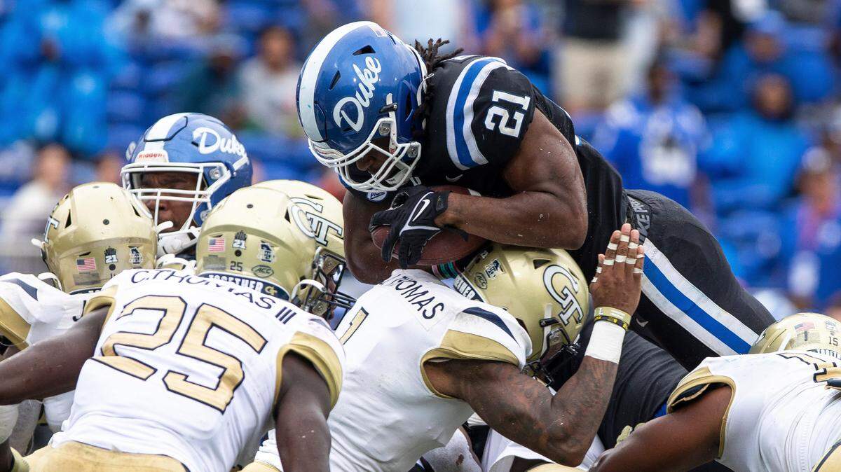 Duke’s Mataeo Durant (21) jumps over the Georgia Tech defense for a touchdown during the second half of an NCAA football game in Durham, N.C., Saturday, Oct. 9, 2021.
