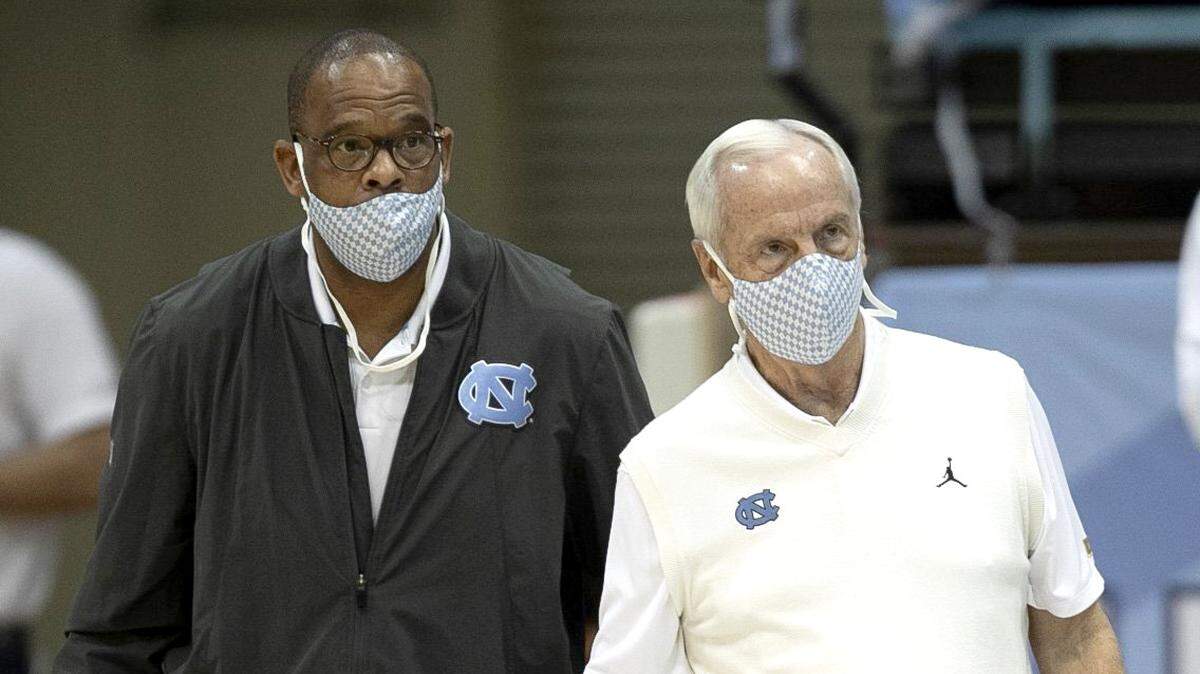 North Carolina coach Roy Williams confers with assistant coach Hubert Davis in the first half against NCCU on Saturday, December 12, 2020 at the Smith Center in Chapel Hill, N.C.