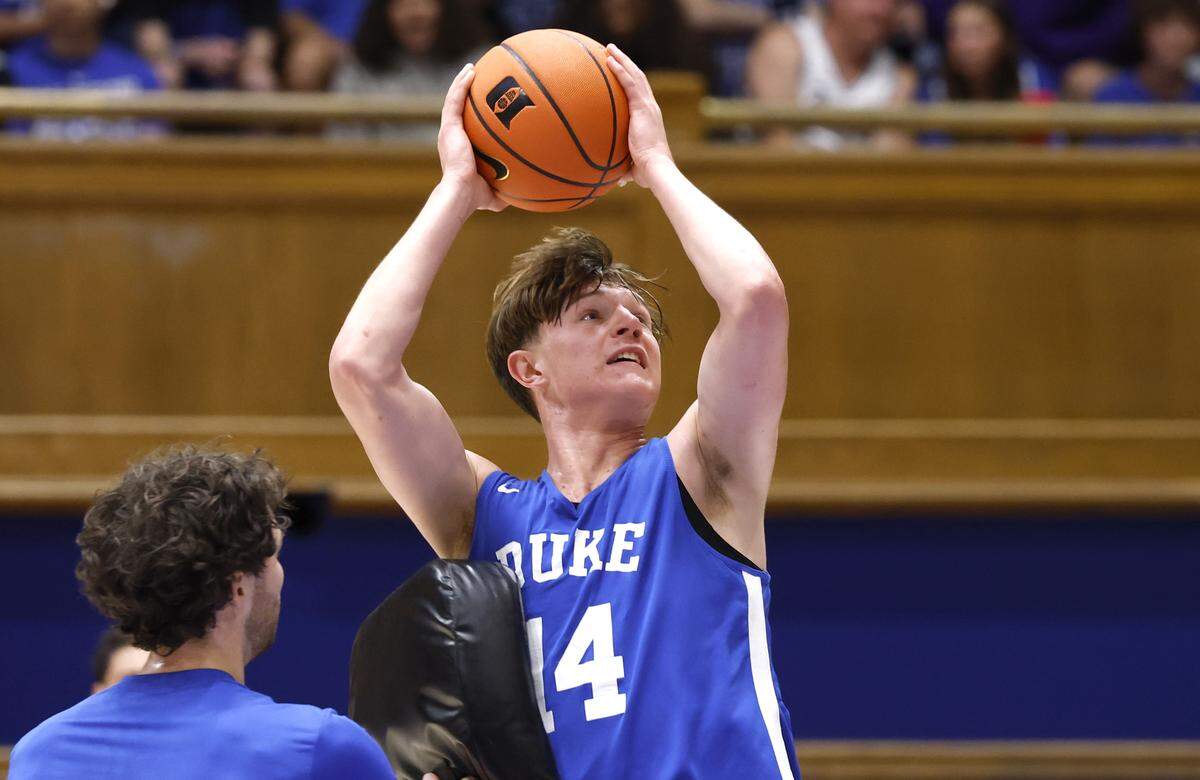 Duke’s Nikolas Khamenia (14) heads to the basket while running a drill during the Blue Devils’ open practice at Cameron Indoor Stadium in Durham, N.C., Tuesday, August 5, 2025.