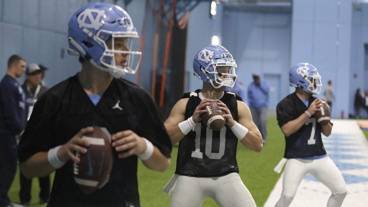 From left, North Carolina quarterbacks Cade Fortin (6), Jace Ruder (10) and Sam Howell (7) run drills during UNC’s first spring football practice in Chapel Hill, N.C., Sunday, March 3, 2019.