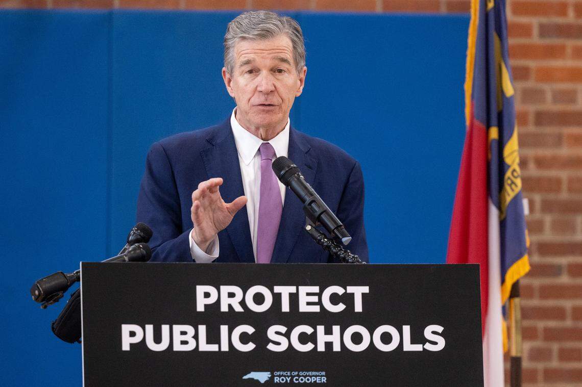 Gov. Roy Cooper speaks after a tour of Washington Magnet Elementary School in Raleigh Tuesday, May 23, 2023. Cooper says state lawmakers would ‘starve’ public education with universal private school vouchers, more tax cuts and small raises for veteran teachers.