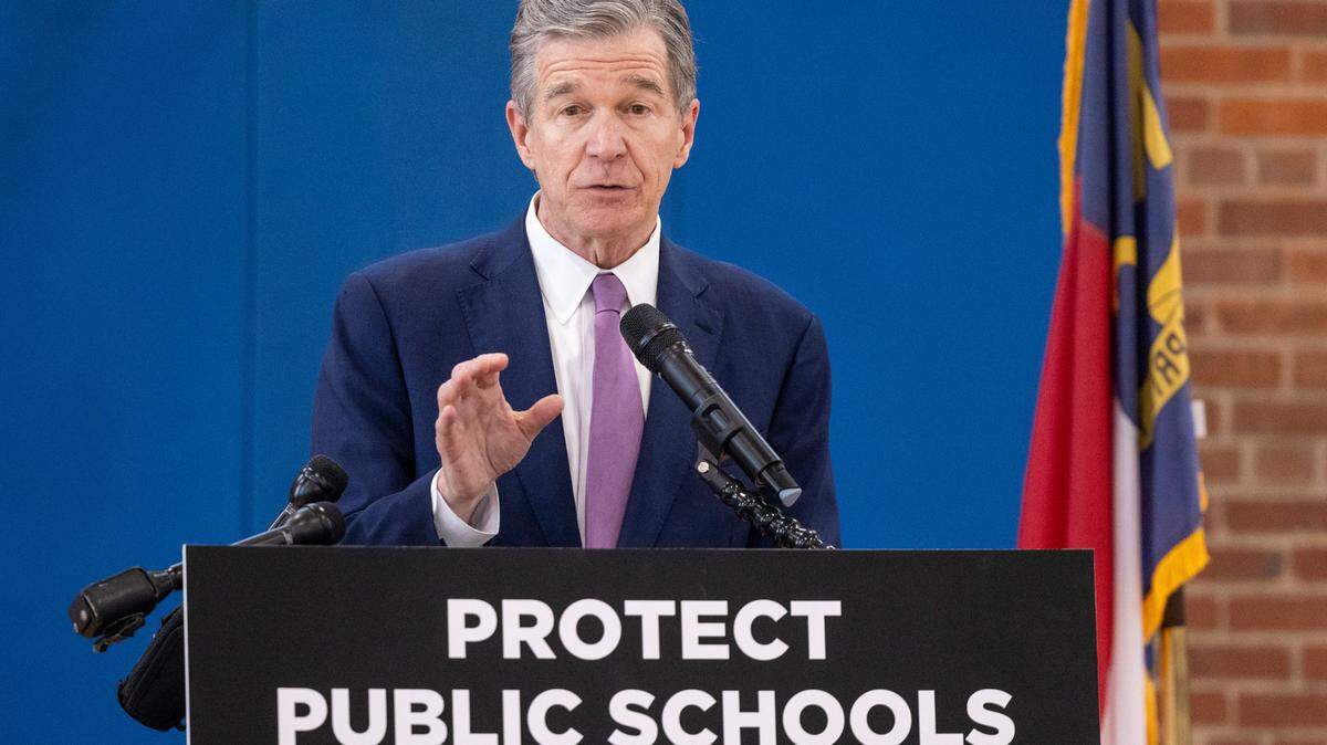 Gov. Roy Cooper speaks at Washington Magnet Elementary School in Raleigh on May 23, 2023. A day earlier, the governor declared a state of emergency in public education, saying that state lawmakers would “starve” public education with universal private school vouchers, more tax cuts and small raises for veteran teachers.