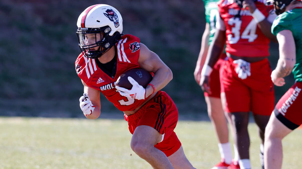 N.C. State running back Jordan Houston (3) runs downfield during the first day of the Wolfpack’s spring football practice in Raleigh, N.C., Wednesday, March 2, 2022.