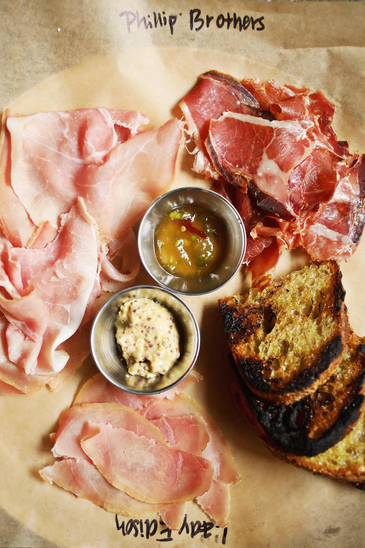 A trio of paper thin slices of North Carolina country ham will be served at High Horse in downtown Raleigh’s historic City Market. The menu is rustic American with nods to North Carolina cuisine.