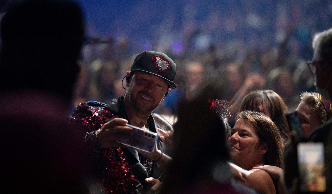 Donnie Wahlberg poses for a selfie with a fan on the “Mixtape 2022 Tour” at Raleigh, N.C.’s PNC Arena, Friday night, July 22, 2022.