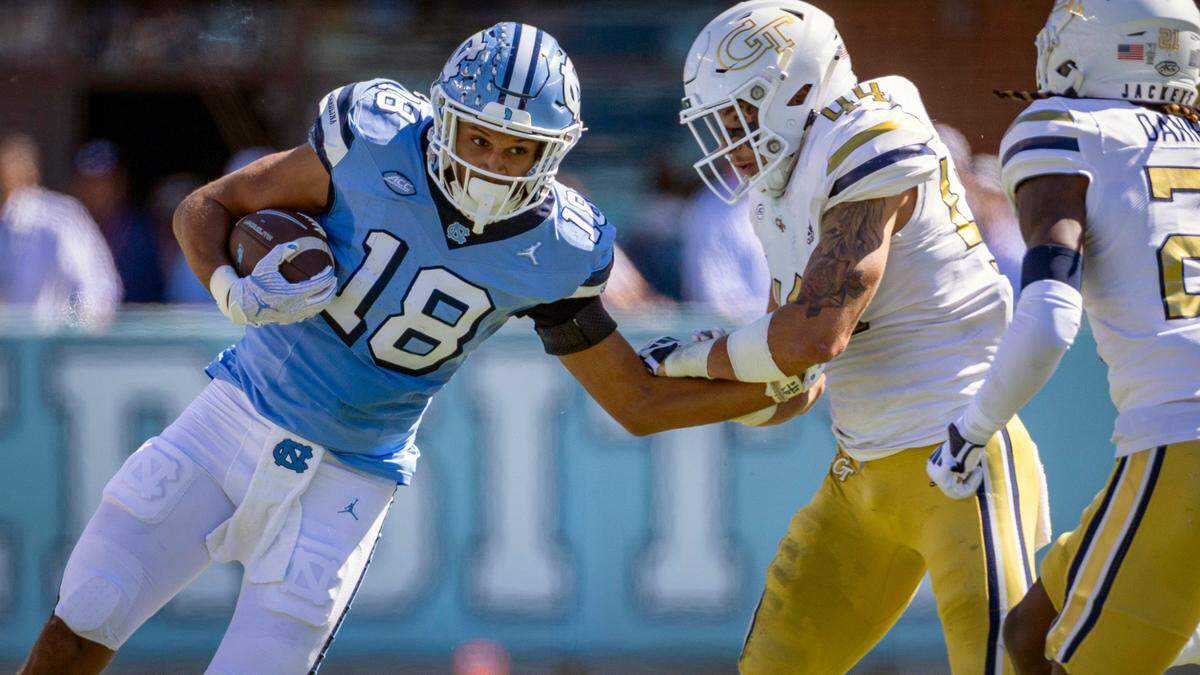 North Carolina tight end Bryson Nesbit (18) picks up 11-yards on a pass completion from quarterback Jacolby Criswell in the first quarter against Georgia Tech on Saturday, October 12, 2024 at Kenan Stadium in Chapel Hill, N.C.