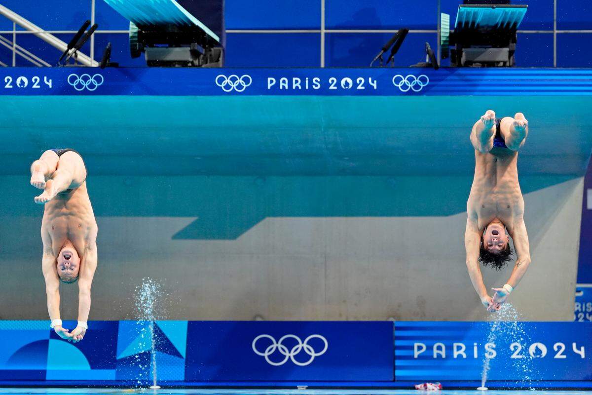 Aug 2, 2024; Paris, France; Tyler Downs (USA) and Greg Duncan (USA) compete during men’s synchronized 3m springboard finals during the Paris 2024 Olympic Summer Games at Aquatics Centre.