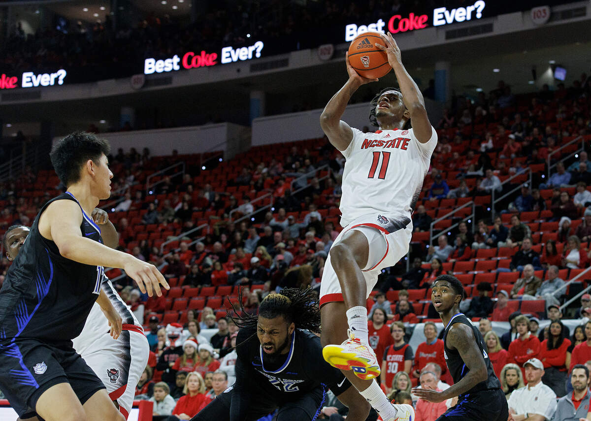 N.C. State’s Dennis Parker Jr. drives past the Saint Louis defense for a shot during the first half of the Wolfpack’s game on Wednesday, Dec. 20, 2023, at PNC Arena in Raleigh, N.C.