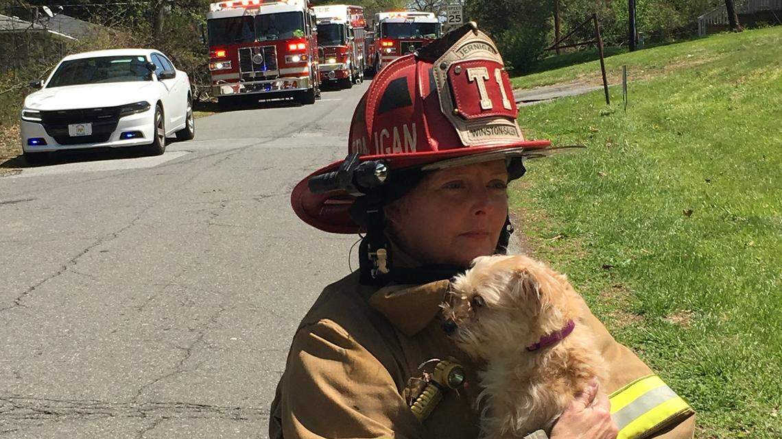 Winston-Salem Fire Department Capt. Kelly Jernigan rescued Cinnamon the dog from a burning apartment fire just a day after she lost her dog, Zion, to cancer.