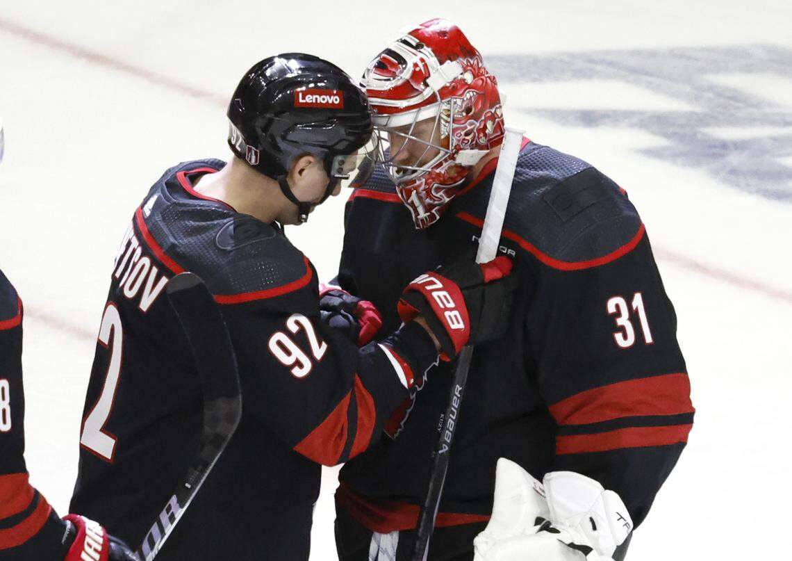Carolina center Evgeny Kuznetsov (92) congratulates goaltender Frederik Andersen (31) after the Hurricanes’ 3-1 victory over the Islanders in the first round of the Stanley Cup playoffs at PNC Arena in Raleigh, N.C., Saturday, April 20, 2024.