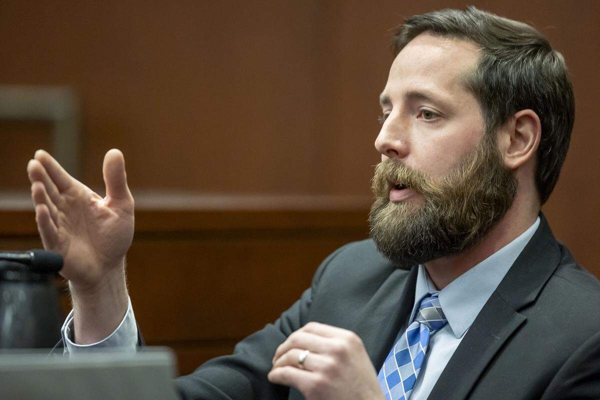 Casey Clark, former Raleigh police officer and a member of the Selective Enforcement Unit, describes being hit in the knee by a gunshot during the search for the suspect in the Hedingham mass shooting in the sentencing of Austin Thompson on Wednesday, February, 4, 2026 in Raleigh, N.C.