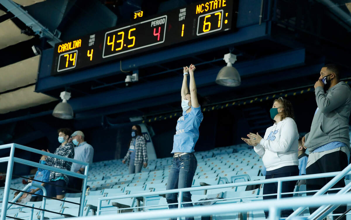 North Carolina fans cheer on the team during the second half of UNC’s 76-69 victory over N.C. State at Carmichael Arena in Chapel Hill, N.C., Sunday, February 7, 2021.