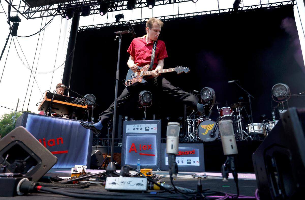 Singer Alexander Kapranosas leaps into the air as Franz Ferdinand opens for the Pixies during a concert at Red Hat Amphitheater in Raleigh, N.C., Friday, June 16, 2023.