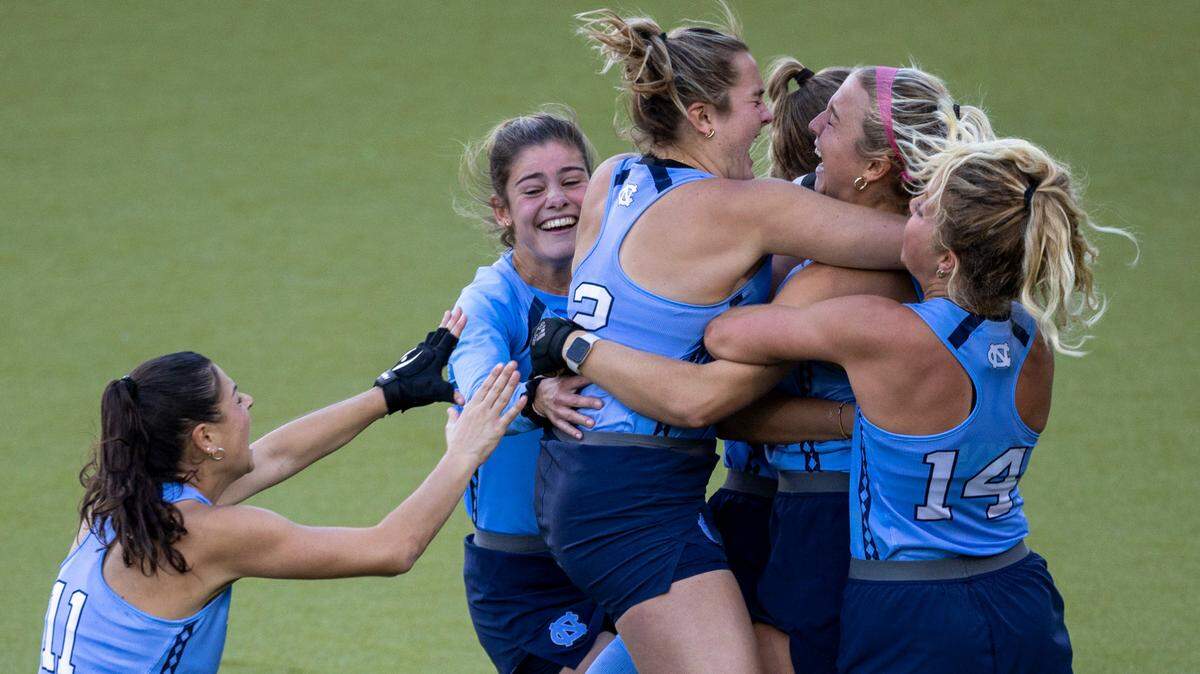 North Carolina’s Charly Bruner (2) embraces Ryleigh Heck (12) after she scored the game winning goal in a sudden death shootout on Northwestern goalie Annabel Skubisz to clinch the NCAA Division I Field Hockey Championship on Sunday, November 19, 2023 at Karen Shelton Stadium in Chapel Hill, N.C.