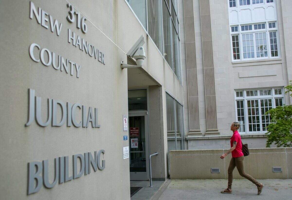 Kiara Brewster walks into the New Hanover County Judicial Building near her main office in Wilmington, NC to write a bond.