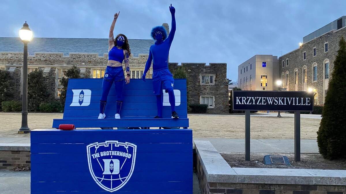 Duke seniors Stephanie Crater (left) and David Miron pose on a bench in Krzyzewskiville before Duke’s game against North Carolina on Saturday night, Feb. 7, 2021. Spectators were not allowed inside Cameron Indoor Stadium, but Crater and Miron dressed up, anyway.