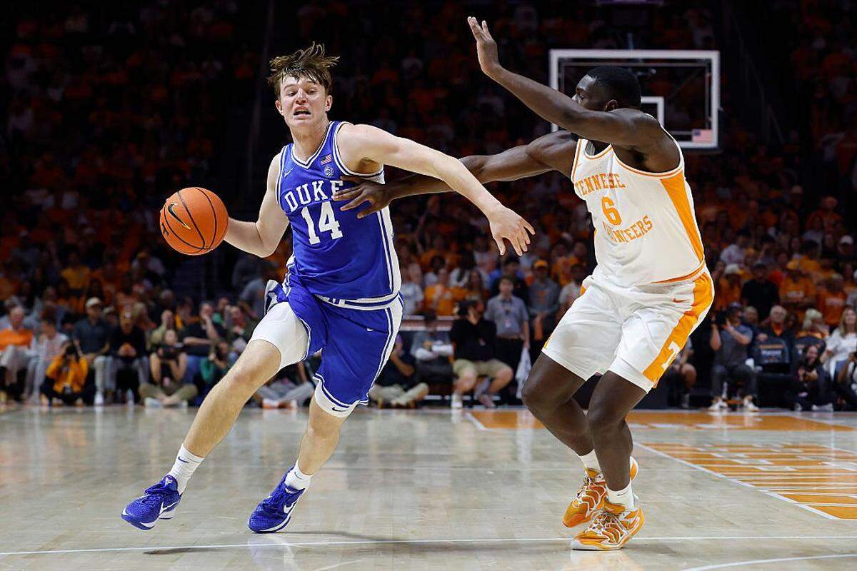 Nikolas Khamenia (14) of the Duke Blue Devils dribbles against DeWayne Brown II of the Tennessee Volunteers during the first half at Thompson-Boling Arena on October 26, 2025 in Knoxville, Tennessee.