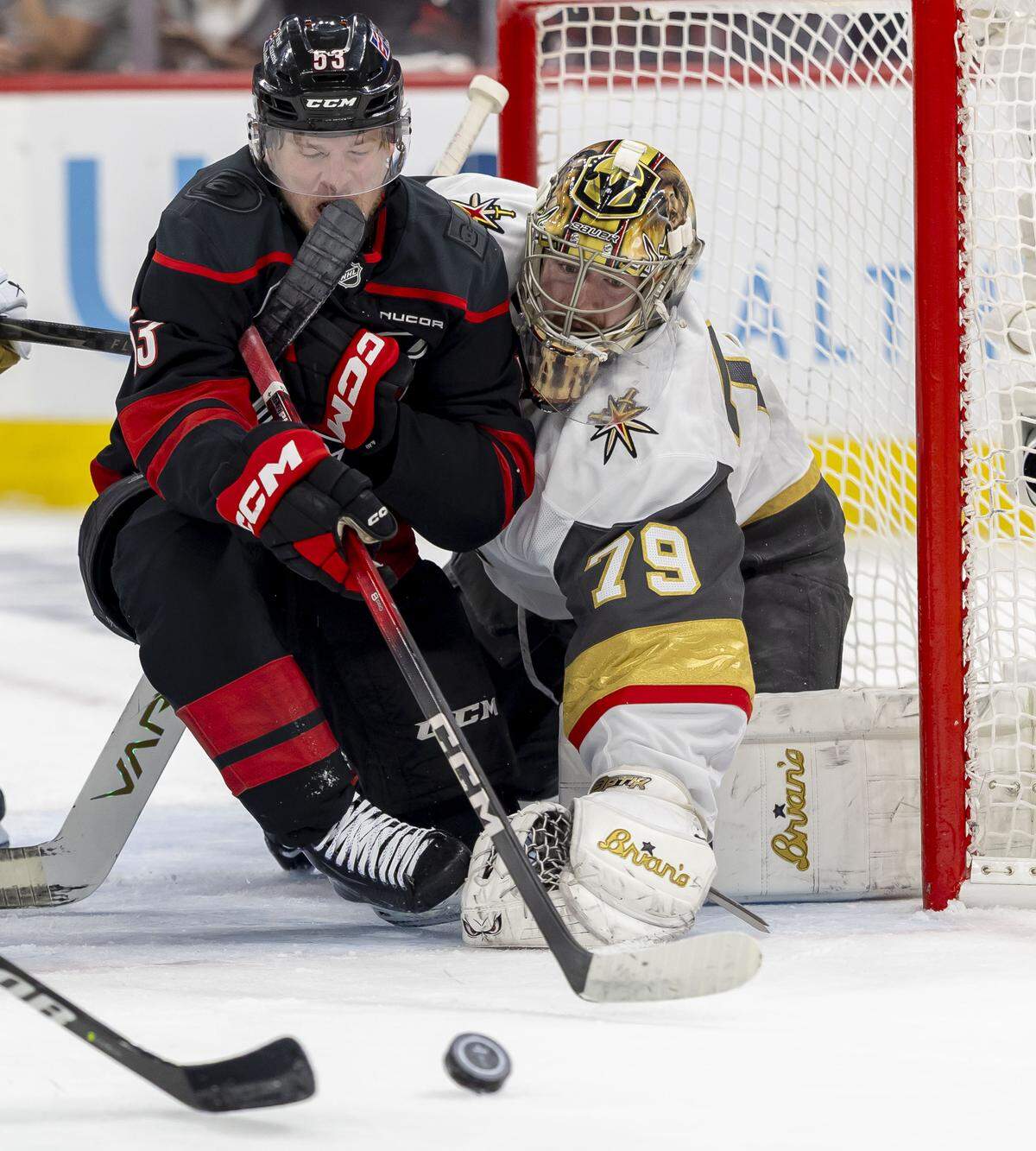 Carolina Hurricanes right wing Jackson Blake (53) takes a stick to his mouth as he works to control the puck against Vegas goalie Carter Hart (79) in the first period in Game 2 of the Stanley Cup Final, on Thursday, June 4, 2026 at Lenovo Center in Raleigh, N.C.