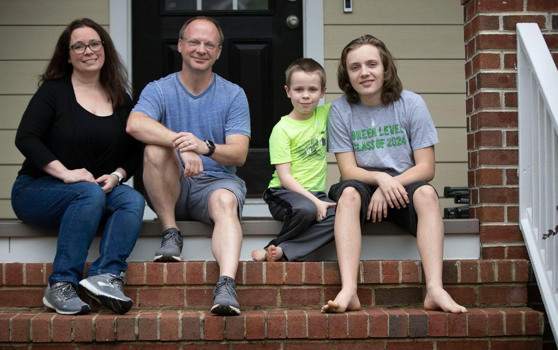 Lynda Manus with her husband Brandon Manus and sons, Bryce and Bryan at their Cary, N.C. home on Friday, March 26, 2021. Lynda and her husband both work from home and have seen first hand the toll virtual learning has had on their family.
