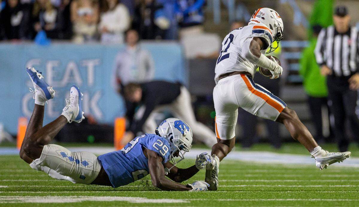 Virginia’s Perris Jones (2) breaks away from North Carolina’s Marcus Allen (29) in the first quarter on Saturday, October 21, 2023 at Kenan Stadium in Chapel Hill, N.C.