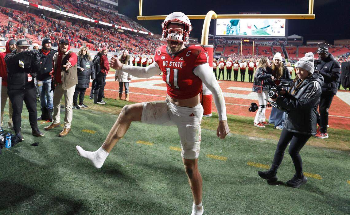 N.C. State linebacker Payton Wilson (11) celebrates as he comes off the field after N.C. State’s 39-20 victory over UNC at Carter-Finley Stadium in Raleigh, N.C., Saturday, Nov. 25, 2023.
