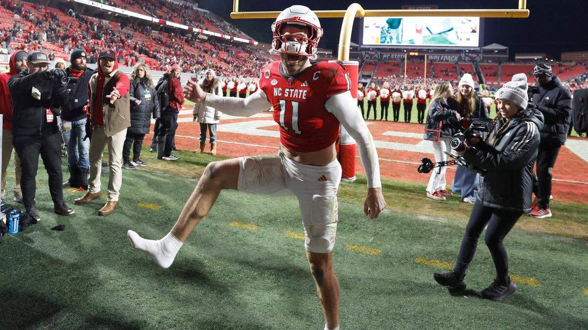 N.C. State linebacker Payton Wilson (11) celebrates as he comes off the field after N.C. State’s 39-20 victory over UNC at Carter-Finley Stadium in Raleigh, N.C., Saturday, Nov. 25, 2023.