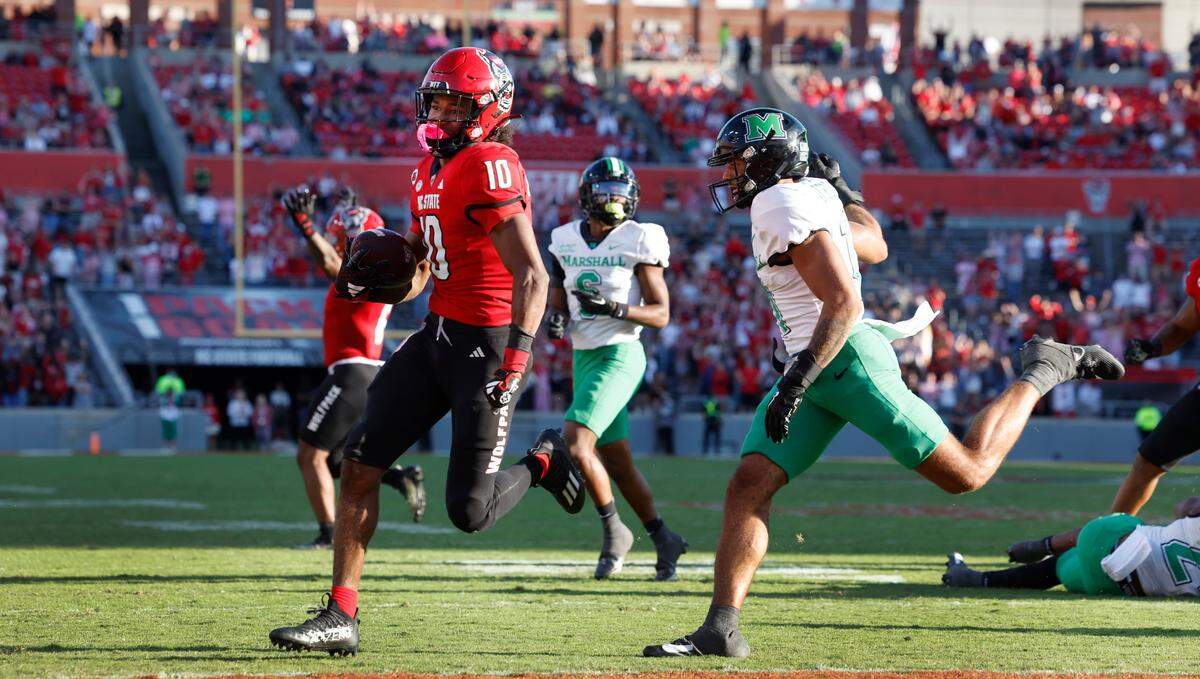 N.C. State wide receiver KC Concepcion (10) runs in on an 8 yard touchdown reception in the second half of N.C. State’s 48-41 victory over Marshall at Carter-Finley Stadium in Raleigh, N.C., Saturday, Oct. 7, 2023.