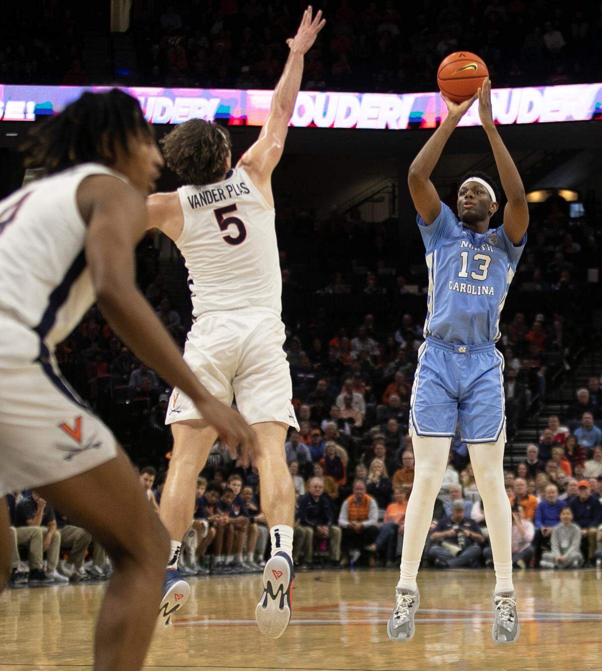 North Carolina’s Jalen Washington (13) puts up a shot against Virginia’s Ben Vander Plas (5) in the second half on Tuesday, January 10, 2023 at John Paul Jones Arena in Charlottesville, Va. Washington scored 13 points.