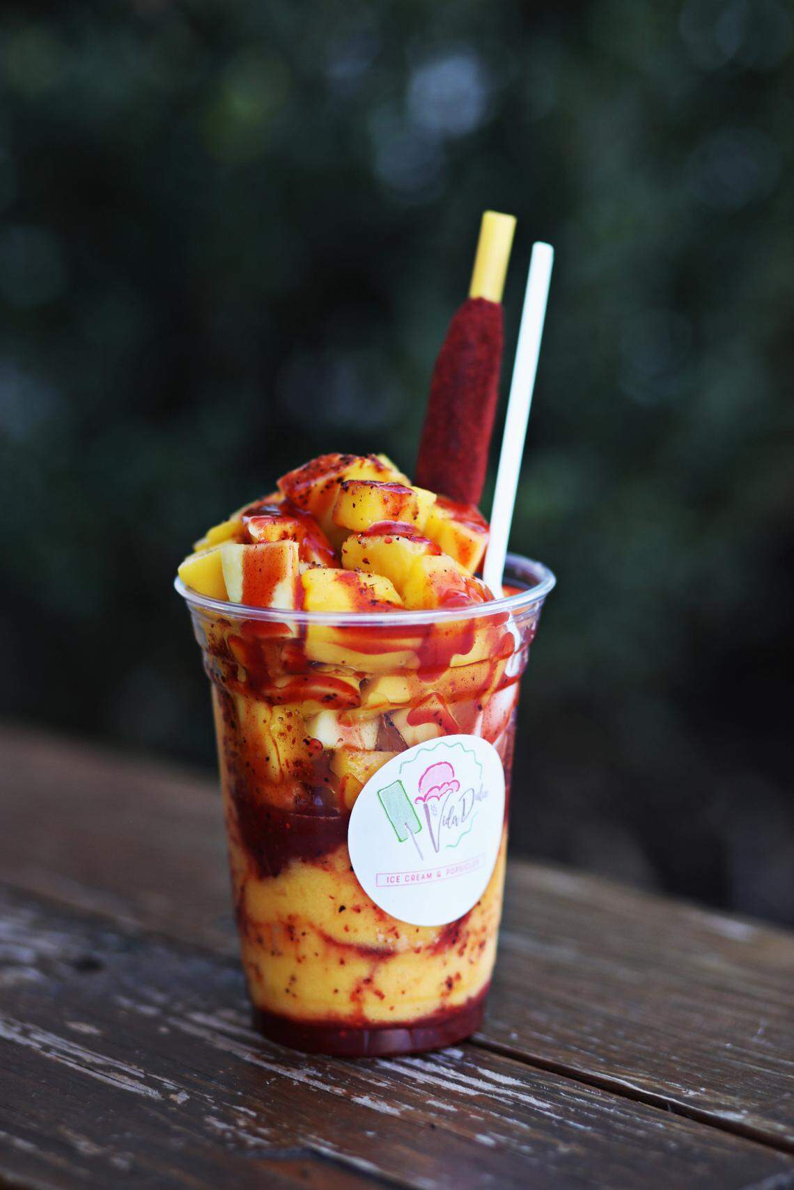 The Mangonada is a colorful parfait with fresh mangos, mango sorbet, and cherry-red swirls of spicy, tangy-sweet chamoy sauce at Vida Dulce.