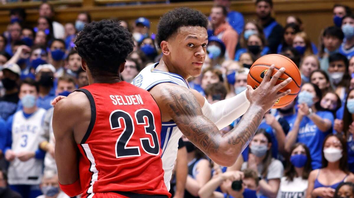 Dukeís Paolo Banchero (5) drives around Gardner-Webb’s Anthony Selden (23) during the first half of Dukeís game against Gardner-Webb at Cameron Indoor Stadium in Durham, N.C., Tuesday, November 16, 2021.