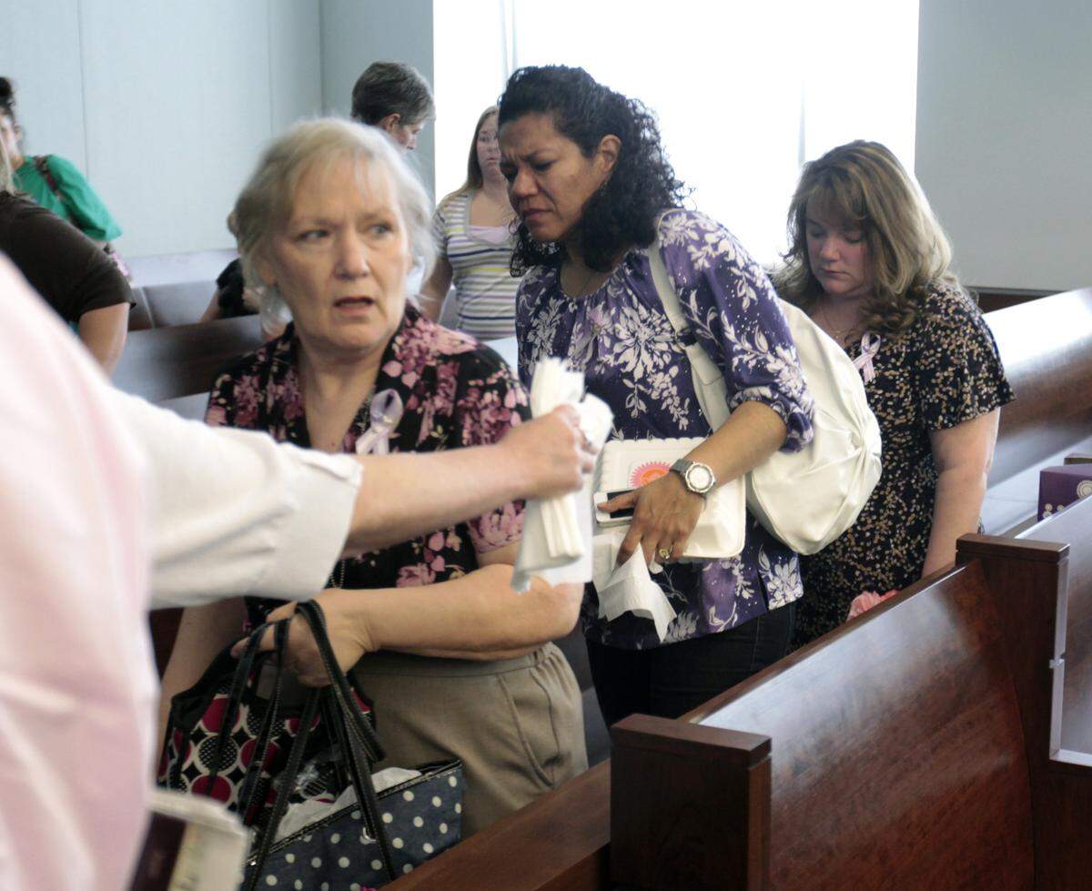 Janet Christiansen, left, mother of the late Janet Abaroa, along with other family members leave Durham County Superior Court Friday afternoon, May 31, 2013 after Judge Orlando Hudson declared a mistrial in the murder case against Raven Abaroa in the murder of Janet Abaroa in Durham in 2005. The Abaroa jury stayed deadlocked 11-1 Friday with Hudson declaring a mistrial late Friday afternoon.