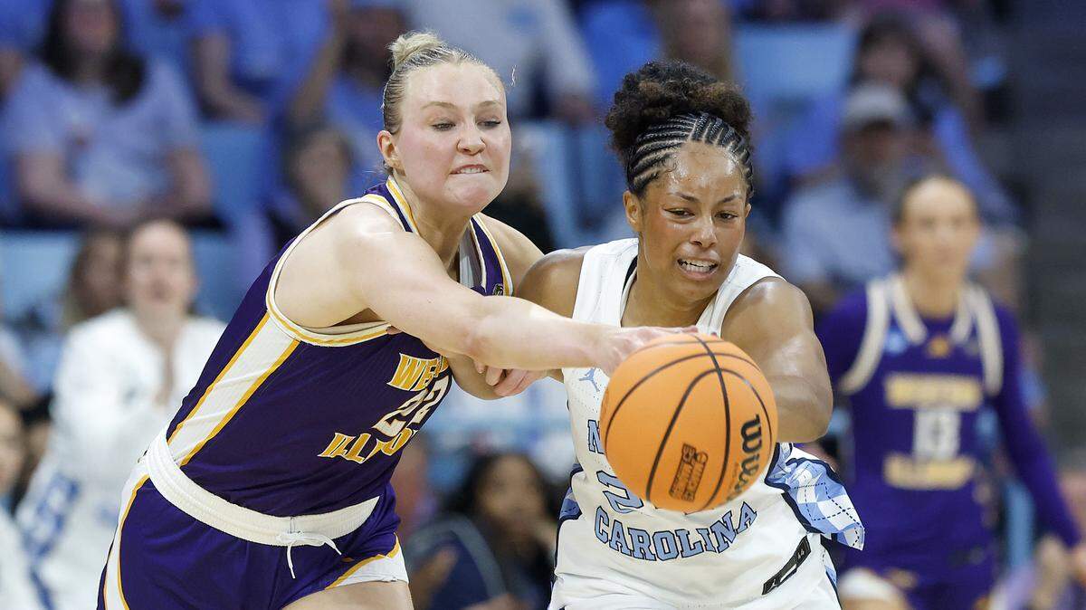 Western Illinois’ Mia Nicastro and North Carolina’s Indya Nivar chase after a loose ball during the first half of the Tar Heels’ first-round NCAA Tournament game on Friday, March 20, 2026, at Carmichael Arena in Chapel Hill, N.C.