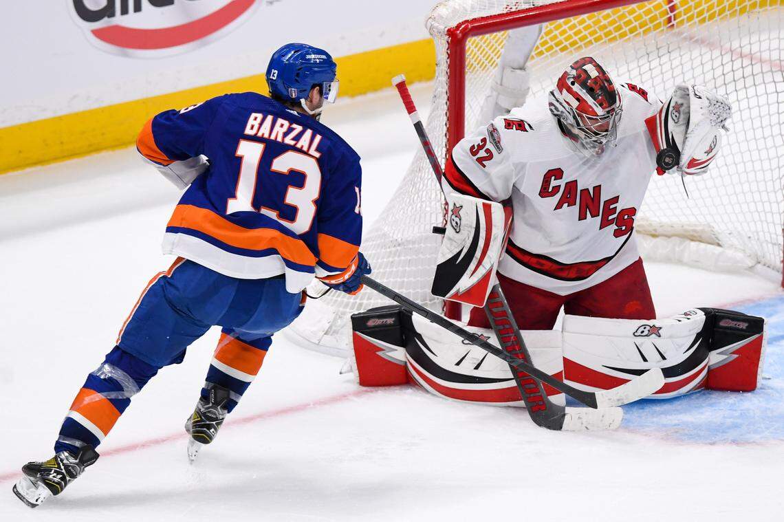 Carolina Hurricanes goaltender Antti Raanta (32) makes a save on New York Islanders center Mathew Barzal (13) during the third period in game three of the first round of the 2023 Stanley Cup Playoffs at UBS Arena.