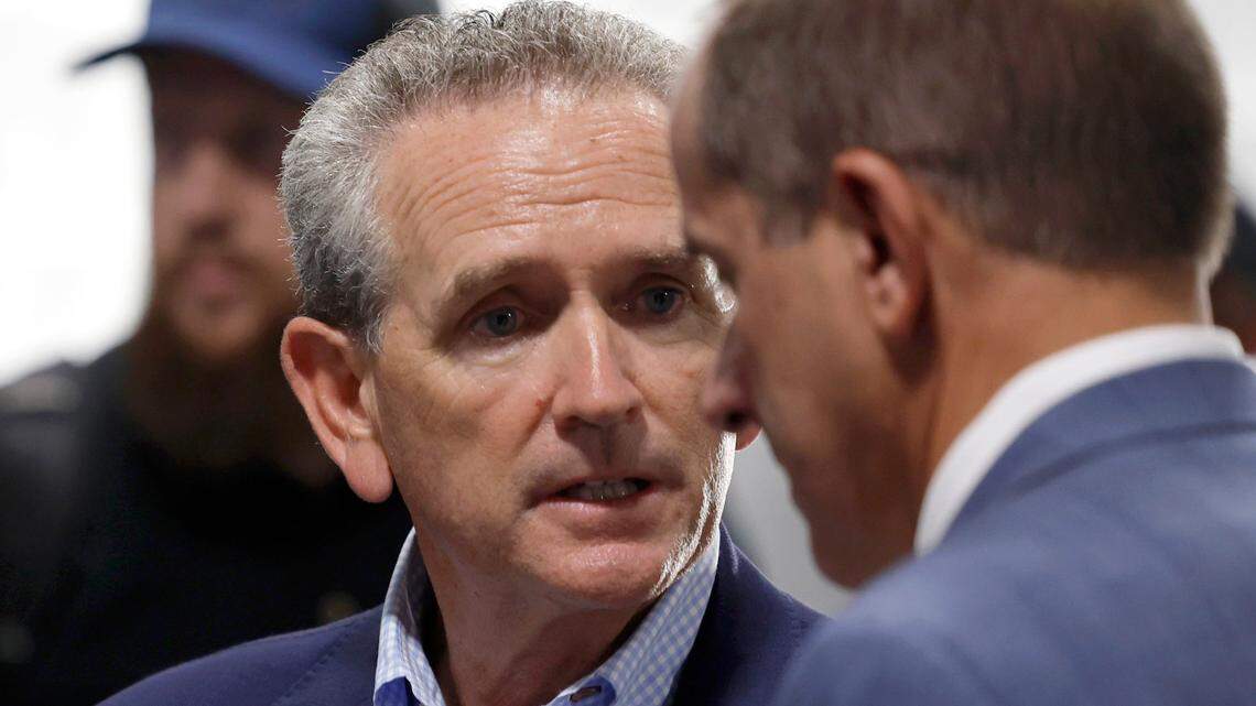 North Carolina athletic director Bubba Cunningham talks with ACC commissioner Jim Phillips before UNC’s game against South Carolina in the Duke’s Mayo Classic at Bank of America Stadium in Charlotte, N.C., Saturday, Sept. 2, 2023.