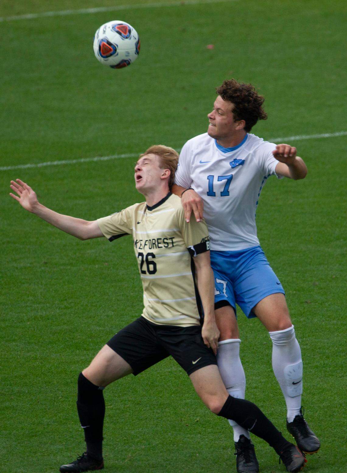 Wake Forest’s Colin Thomas (26) and UNC-Chapel Hill’s Cameron Fisher (17) battle for the ball during the Division I Men’s Soccer Championship quarterfinals at WakeMed Soccer Park in Cary Monday, May 10, 2021.
