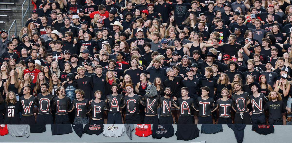 N.C. State students sing the alma mater before the Wolfpack’s game against Louisville at Carter-Finley Stadium in Raleigh, N.C., Friday, Sept. 29, 2023.