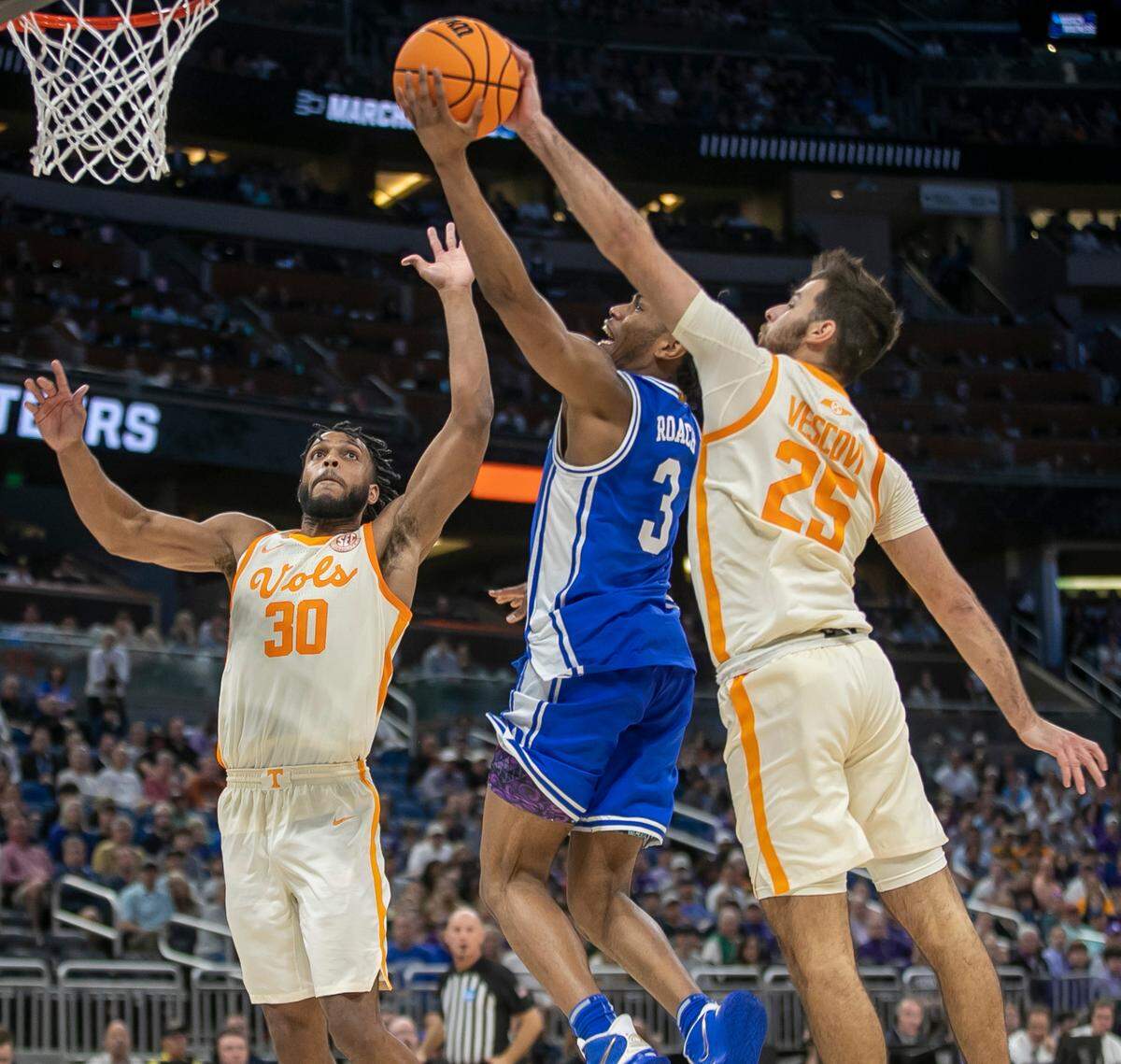 Tennessee’s Santiago Vescovi (25) blocks a shot by Duke’s Jeremy Roach (3) late in the second half in the second round of the NCAA Tournament on Saturday, March 18, 2023 at the Amway Center in Orlando, Fla.