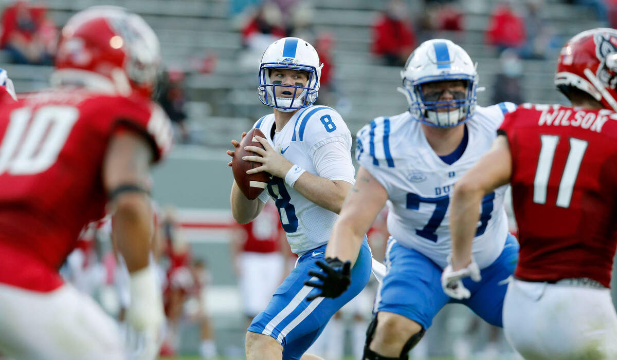 Duke quarterback Chase Brice (8) looks for a receiver during the first half of N.C. State’s game against Duke at Carter-Finley Stadium in Raleigh, N.C., Saturday, Oct. 17, 2020.