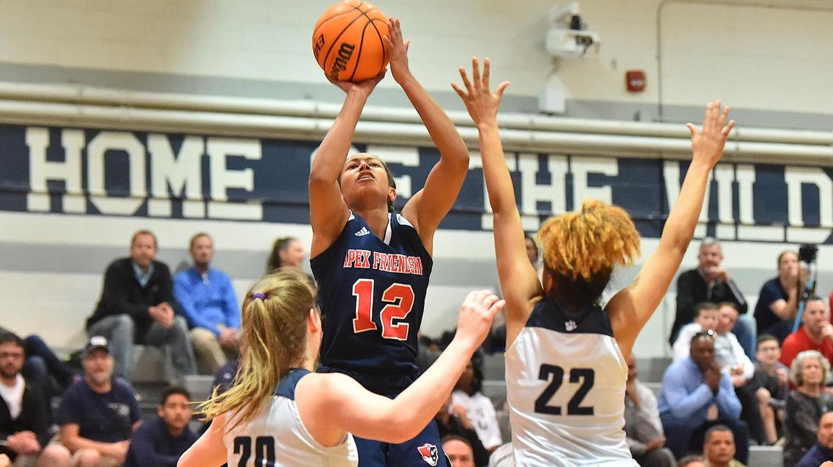 Apex Friendship’s Indya Nivar (12) shoots over Millbrook’s Bernadette Rodts (20) and Skylar Jones (22). The Apex Friendship Patriots and the Millbrook Wildcats met in a NCHSAA 4A fourth round game in Raleigh, N.C. on March 3, 2020.