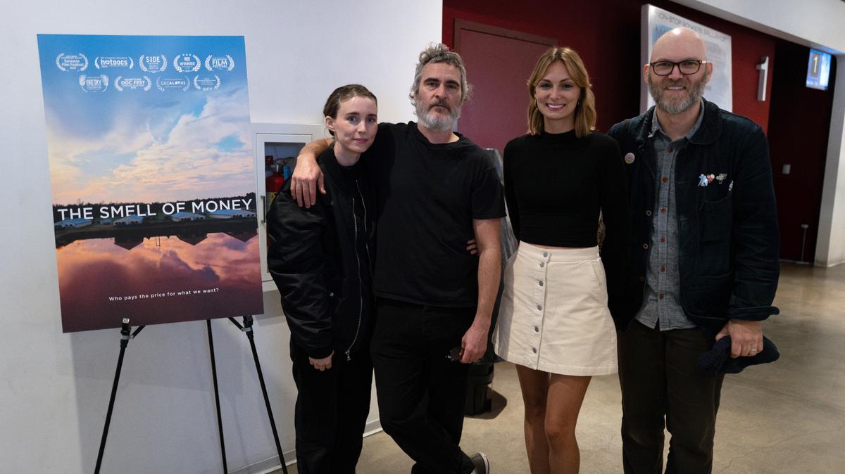 Actors Rooney Mara and Joaquin Phoenix, on left, with the hog farm documentary’s writer and producer Jamie Berger and its director Shawn Bannon.