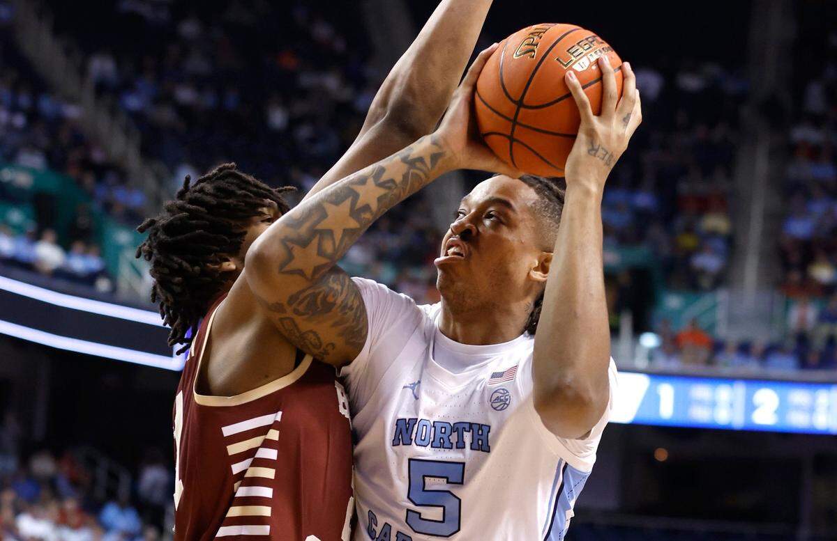 North Carolina’s Armando Bacot (5) works against Boston College’s Devin McGlockton (21) during the first half of UNC’s game against Boston College in the second round of the New York Life ACC Men’s Basketball Tournament in Greensboro, N.C., Wednesday, March 8, 2023.