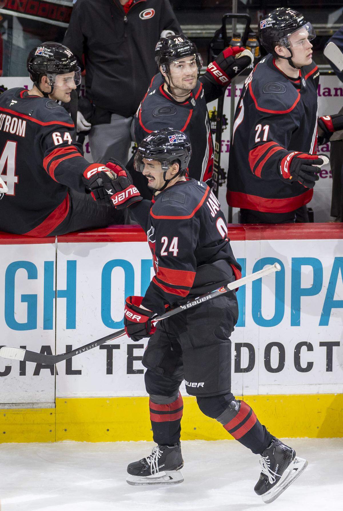 Carolina center Seth Jarvis (24) skates to the bench after scoring in the second period against the Dallas Stars to take 5-1 lead on Tuesday, January 6, 2026 at Lenovo Center in Raleigh, N.C. Jarvis returned to the ice Tuesday after missing eight games. 