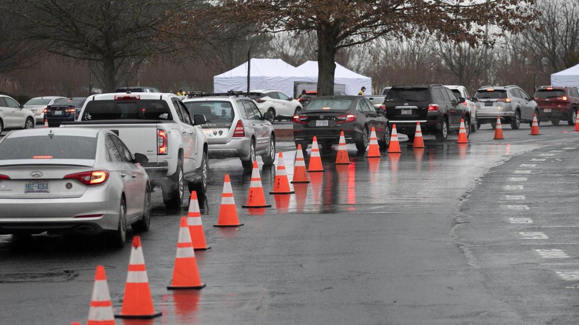 Patients line up their cars to receive the COVID-19 vaccine during a Wake County mass vaccination clinic on Thursday, February 11, 2021 at PNC Arena in Raleigh, N.C.