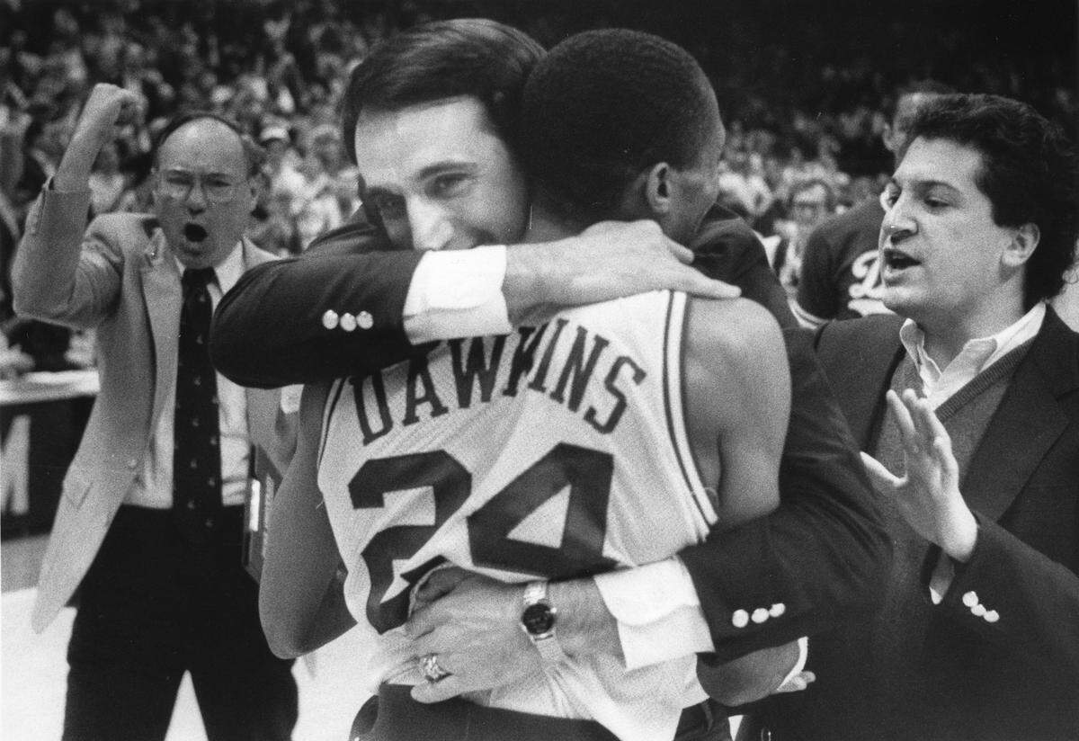 Duke Coach Mike Krzyzewski, left, hugs tournament MVP Johnny Dawkins after Duke defeated Georgia Tech to win the ACC Tournament on March 9, 1986 in Greensboro, NC. It was Krzyzewski's first ACC Tournament Championship. 